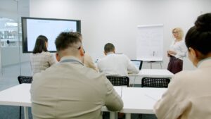 Business people in a modern conference room during a presentation.