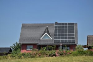 a house with a solar panel on the roof